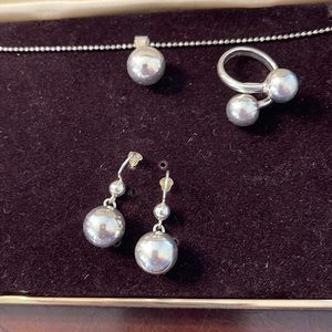 925 printed on them is a set os ring earrings and chains